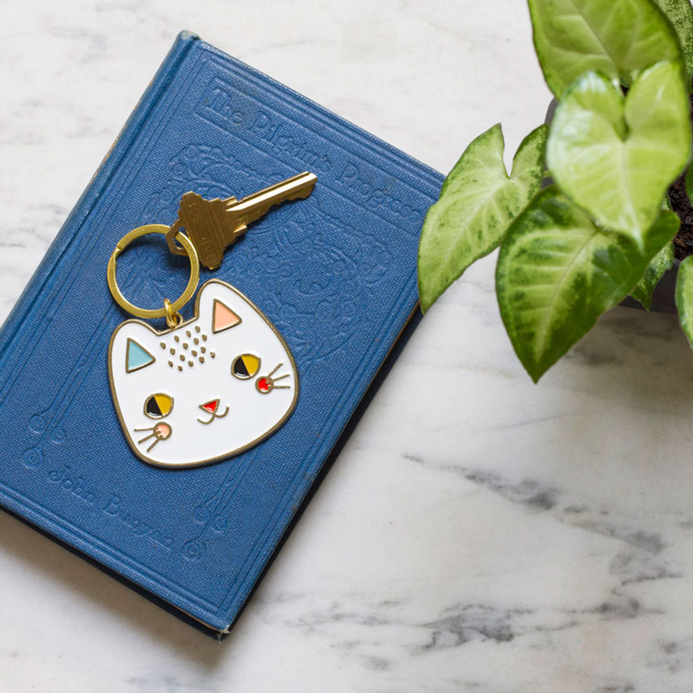 Keychain Meow Meow on a book